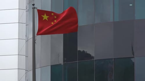 Chinese Flag Waving on Modern Office Building