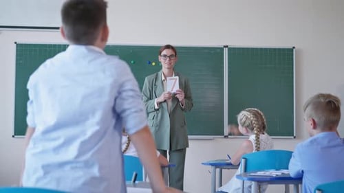 Teacher Teaches Elementary School Students in Classroom