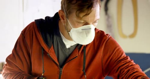 Man making surfboard 4k
