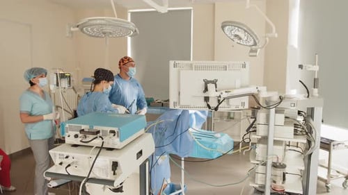 Surgeons Performing Operation in a Hospital Operating Room