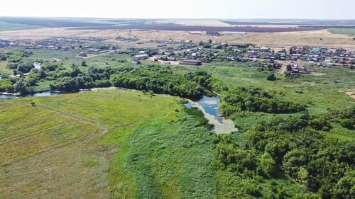 Aerial View Winding River Flowing Between Green Trees. Beautiful Rural Landscape