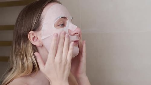 Young Woman Doing Purifying Mask on Her Face