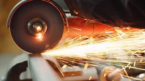 Close up metal cutter grinding with sparks