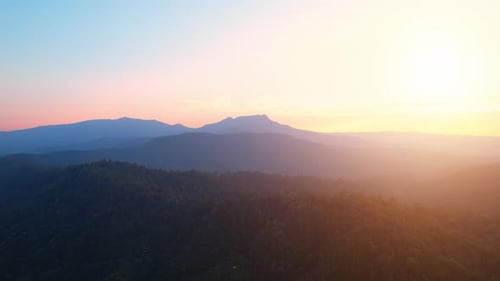 4K Aerial view over beautiful mountains. beautiful sunset over high mountains