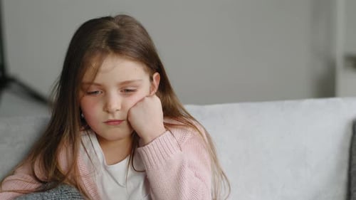 Portrait of Offended Child Closeup Little Sad Upset Preschool Girl Looking at Camera Sits at Home
