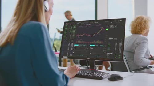 Woman watching financial dashboard