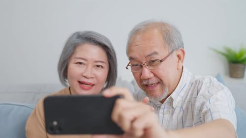 Senior Couple Taking a Selfie with Smartphone Device