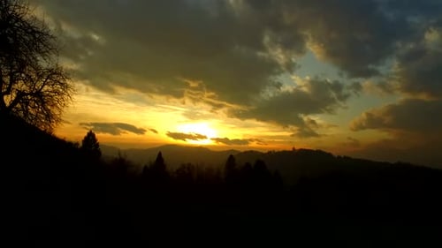Golden Sunset Over Mountainous Landscape