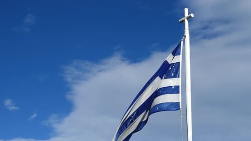 Greek Flag Waving in Wind with Blue Sky