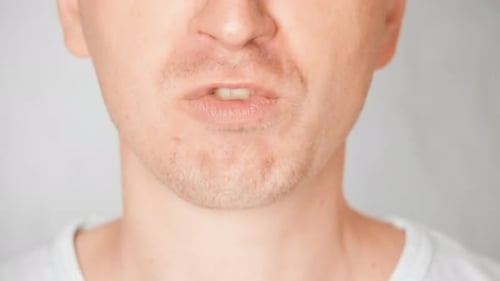 Man Eats Golden Potato Chips Close Up