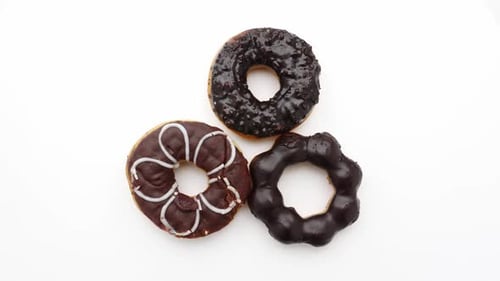 Chocolate donuts on a white background