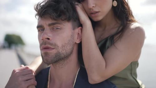 Girl Hugging Boyfriend and Stroking Hair