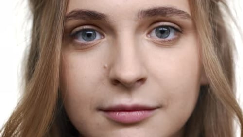 Blonde Woman Smiles in Close Up Portrait
