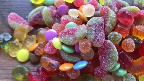 Colorful Assorted Candies Spread on Wooden Table