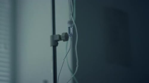 Closeup Iv Drip in Dark Hospital Ward