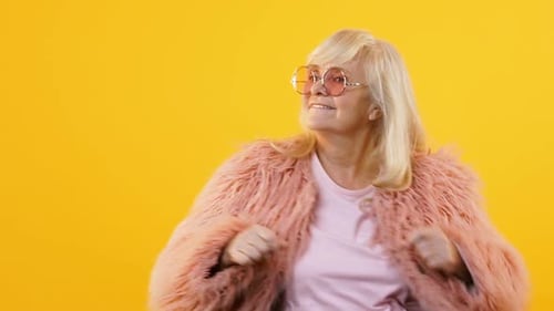 Stylish Granny in Pink Fur and Eyeglasses Moving to Music, Dancing Party, Style