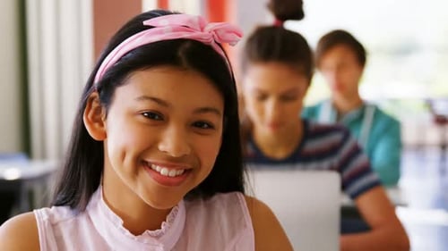 Happy Student Smiling in School Classroom