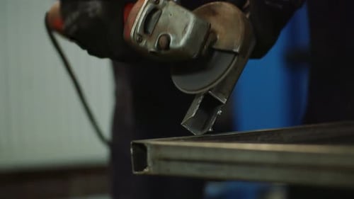 Industry Worker Grinding Metal with Angle Grinder