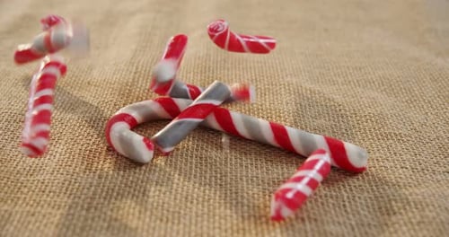 Candy cane falling on textile 4k