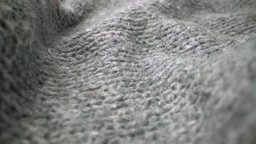 Extreme Detail View of Sheep Wool Cloth Texture Flowing in Macro Dolly Shot
