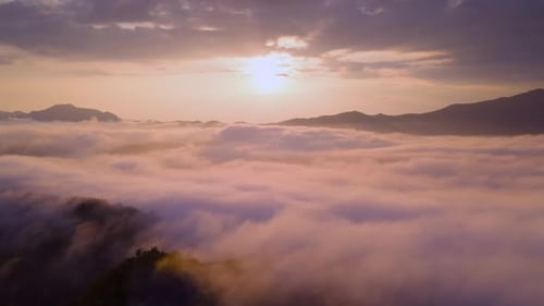 Sunrise Over Majestic Mountain Peaks and Cloudscape