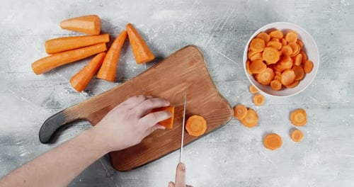 Cutting Carrots on a Cutting Board