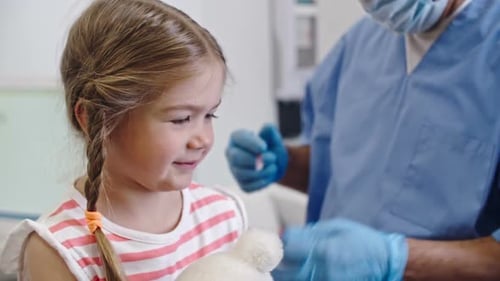 Child Receives Vaccine at Doctor's Office
