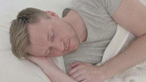 Man Asleep in Bed Top View