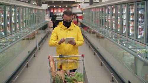 Portrait Of Man With Electronic Shopping List