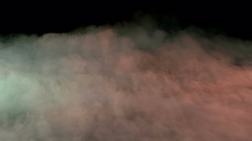 Colorful Wispy Smoke Drifting Against Black Background