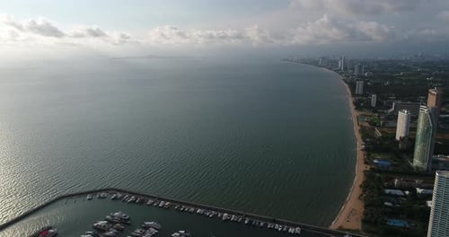 Aerial view of speed boats on the sea near beach city