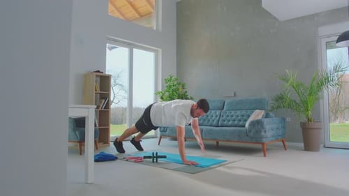 Man Doing Push-Ups and Mountain Climbers at Home