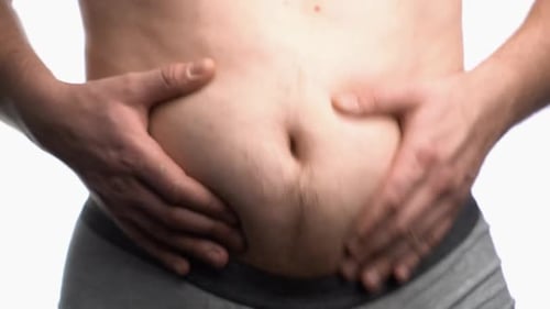 Man Grabing his Excess Belly