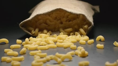 Cloth bag falls and pasta fall out of him