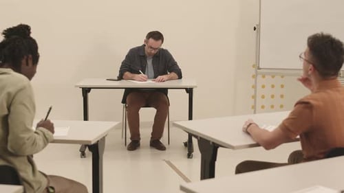 Students Taking Test in Bright Classroom