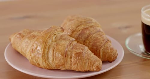 Two Croissants and a Coffee for Breakfast