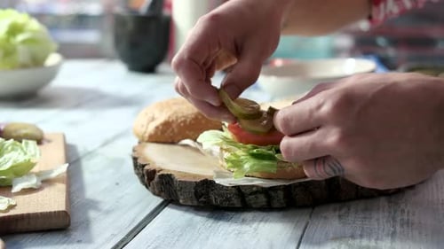 Hands Making Sandwich with Vegetables.