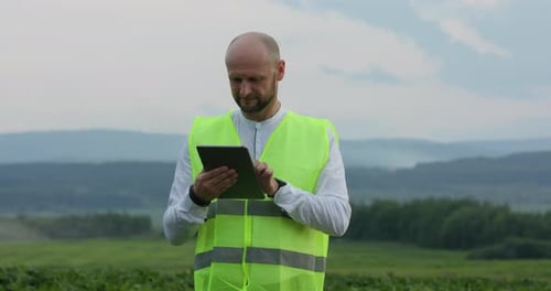 Professional Young Agronomist Uses Digital Technology To Improve Yields