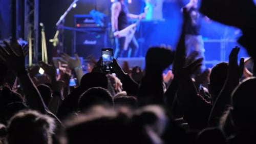 Crowd of People at a Rock Concert Fans Dancing at Open Air Music Festival