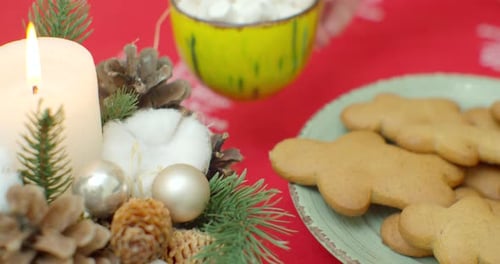 Traditional Christmas Gingerbread Cookies with Ginger on a Wooden Stand. In a Glass of Cocoa with