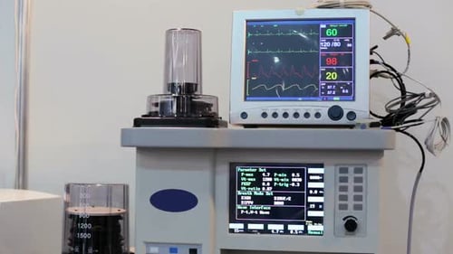 Medical Equipment with Display Screens in Hospital Setting