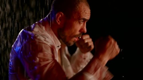 Tough Man is Fighting with Enemy Punching By Arms in Rain in Night