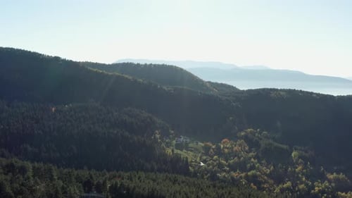 Beautiful Drone Flight Over Mountain Ranges with Slopes and Cliffs Covered