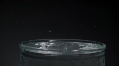 Water Droplets Splashing in a Glass
