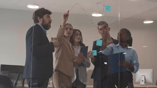 Diverse Team Collaborating and Brainstorming in Modern Office