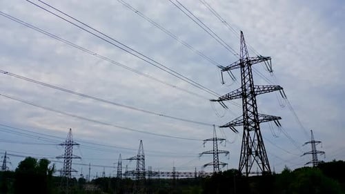Silhouette of electric towers in the evening
