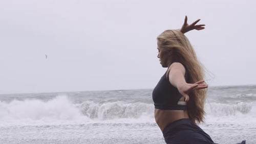 Pretty Dancer Dancing in Black Beach While Raining