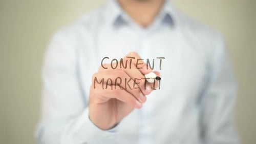 Man Writing Content Marketing on Glass Board