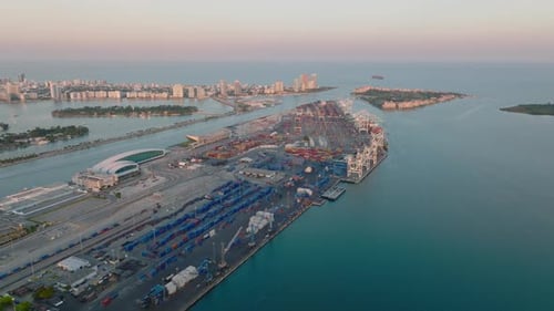 Aerial View of Dodge Island with Large Cargo Harbour and Modern Passenger Terminal in Late Afternoon