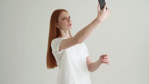 Young Woman Confused Using Smartphone